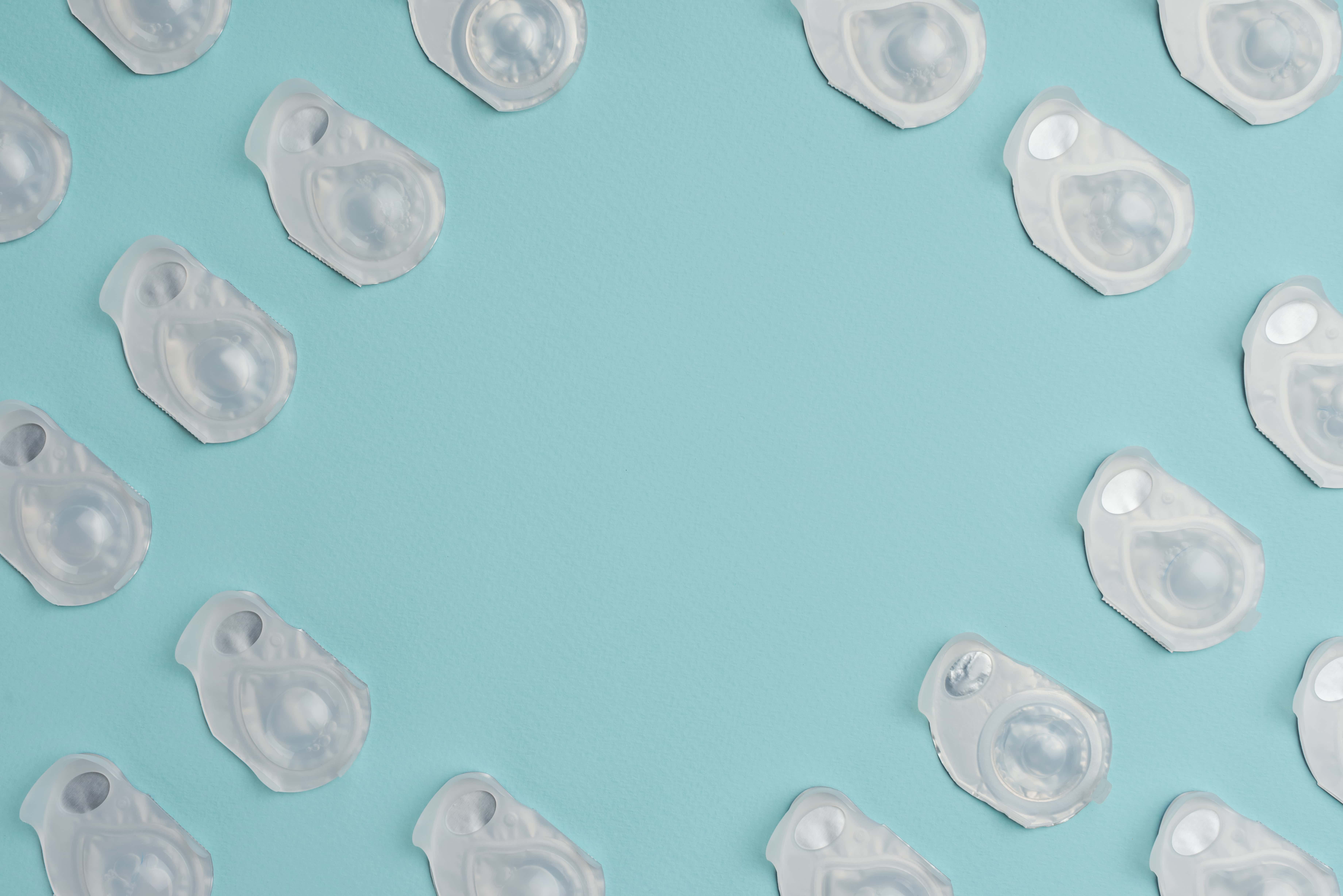 blister packs of contacts laid out on a blue background