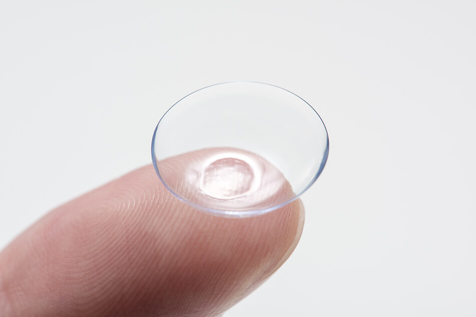 contact lenses on fingertip