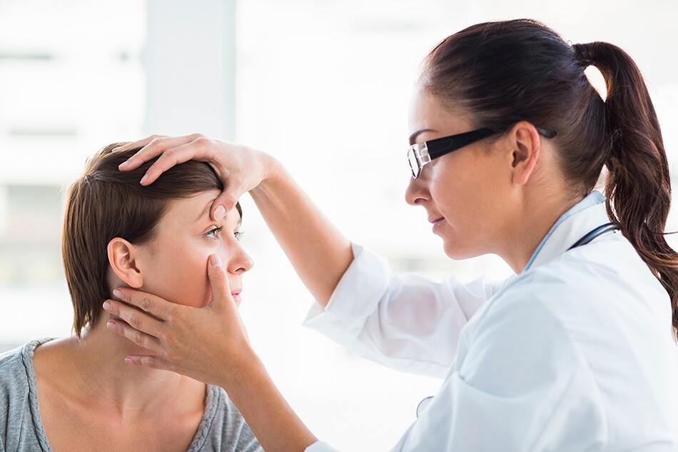 woman talking with eye doctor about wearing contact lenses with an allergy