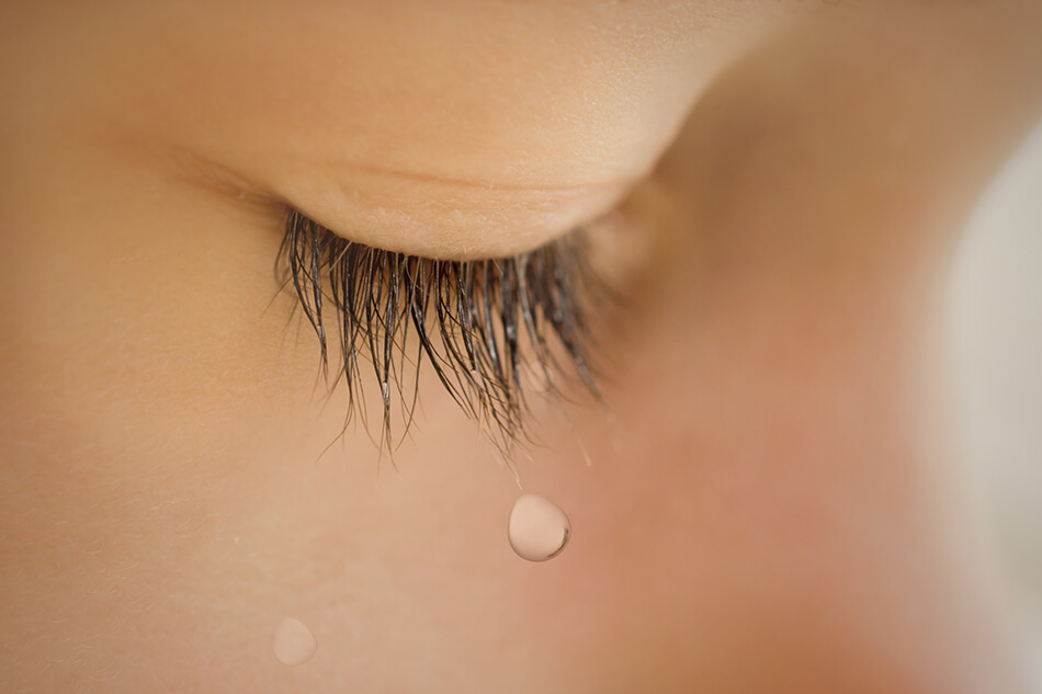 woman’s eye with tears