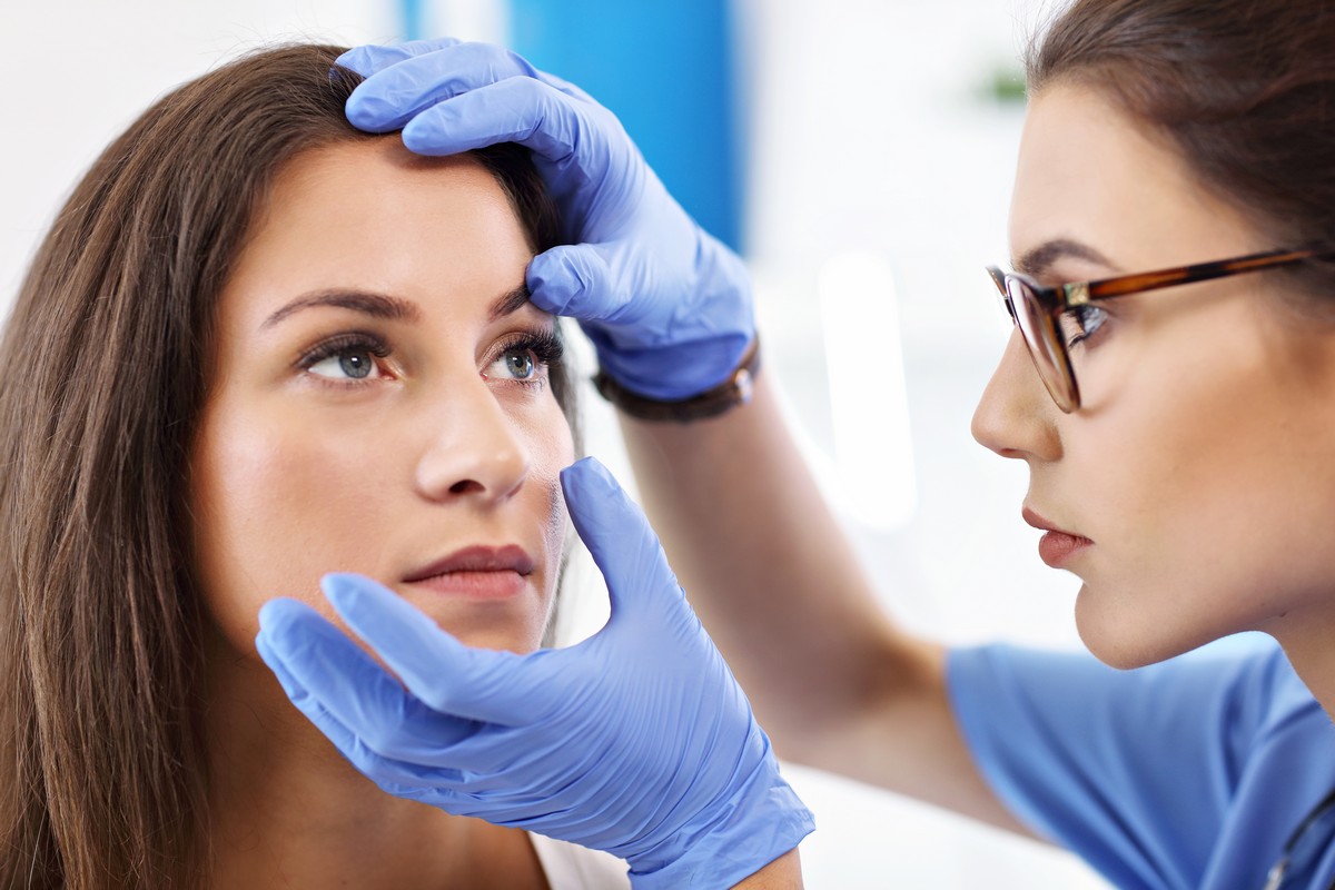 Female Doctor examining woman’s eye for sty