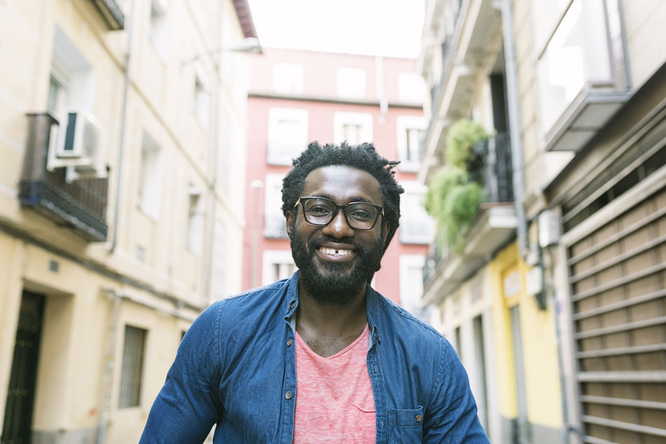 Happy man wearing glasses outdoors