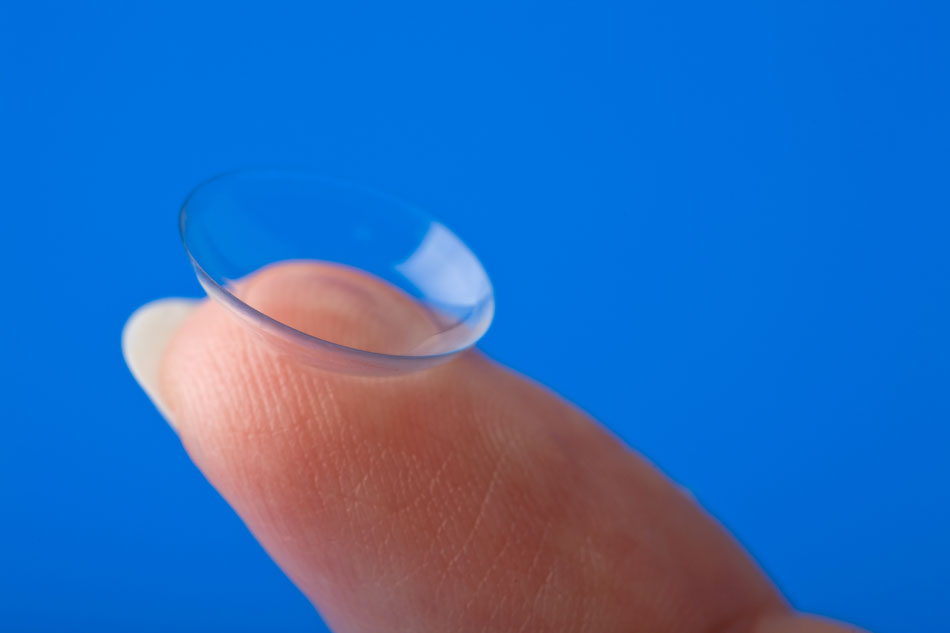 Hard contact lens on fingertip