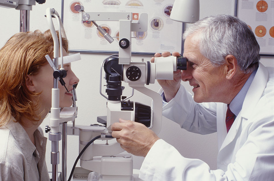 optometrist giving eye exam