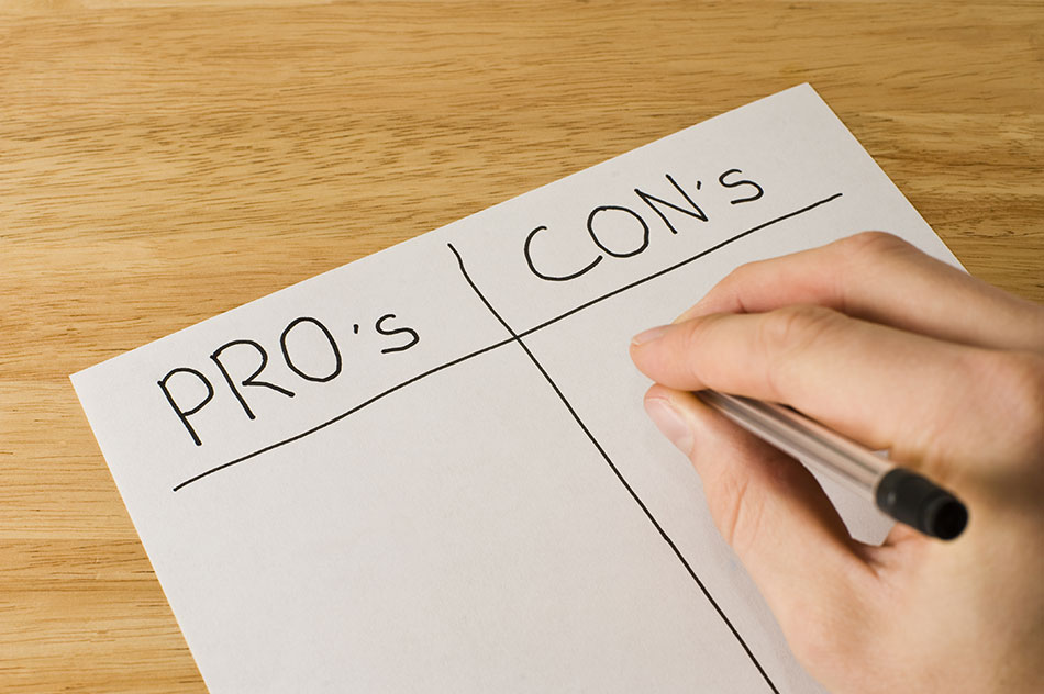 pros and cons written on white paper