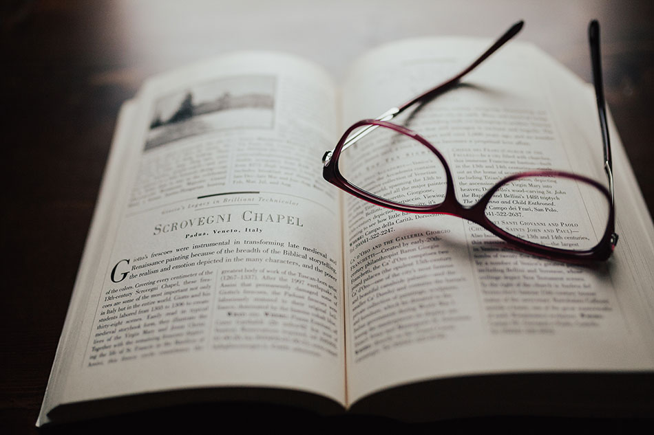 reading glasses on an open book