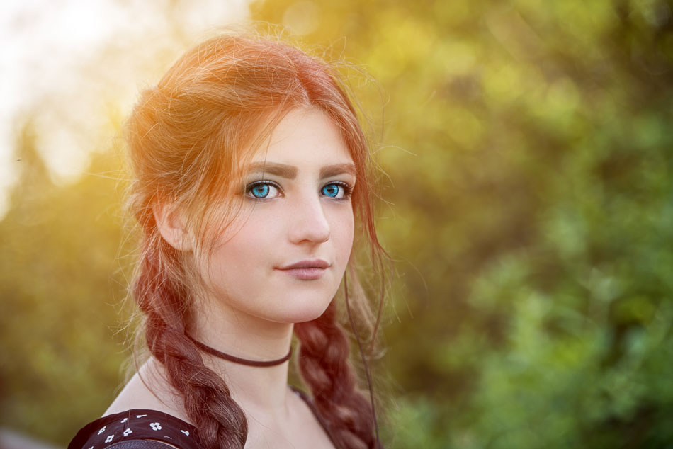 red haired woman with blue contacts