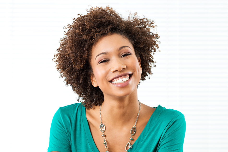 Smiling young woman with no contact lens intolerance