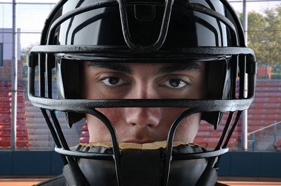 Teen boy baseball catcher closeup