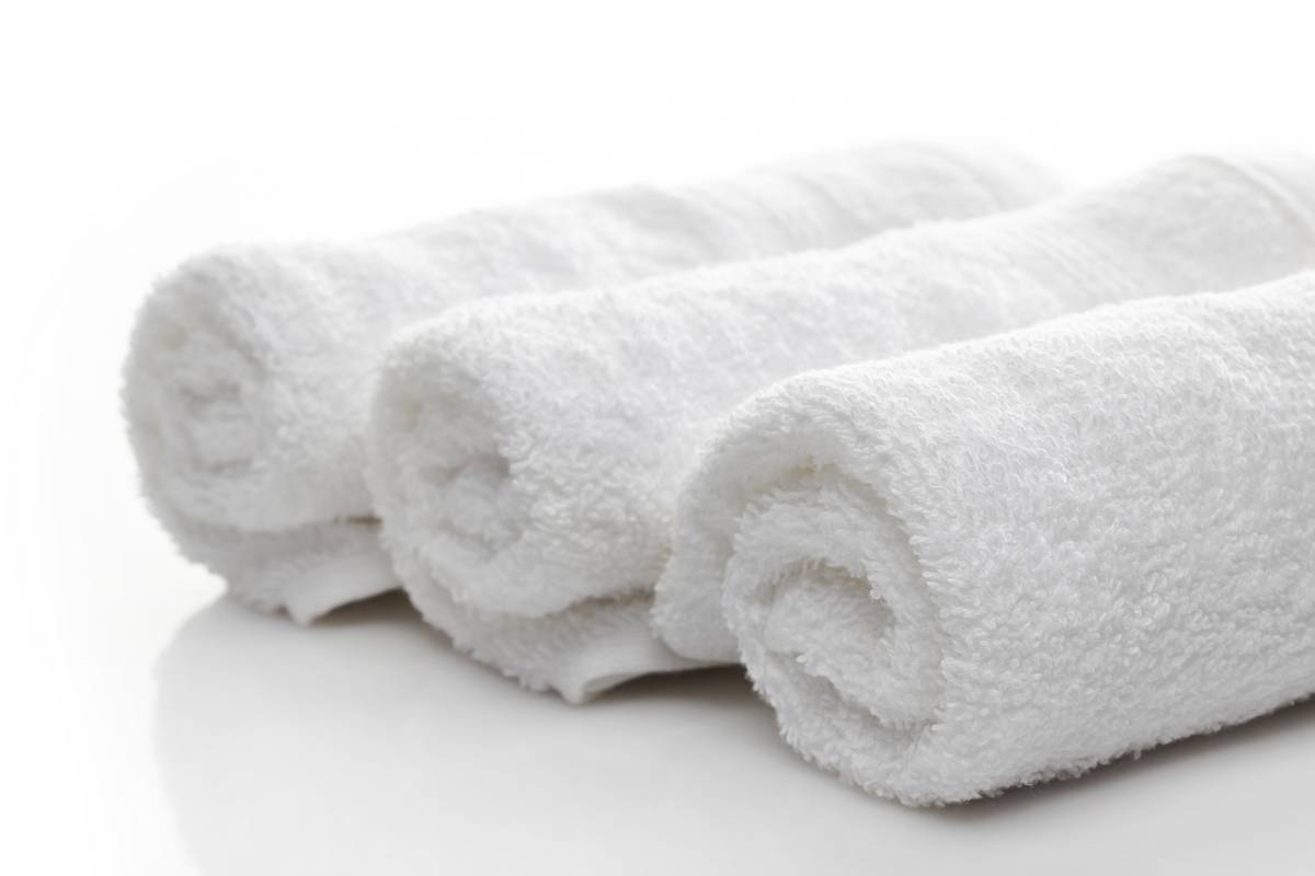 Three folded white spa towels