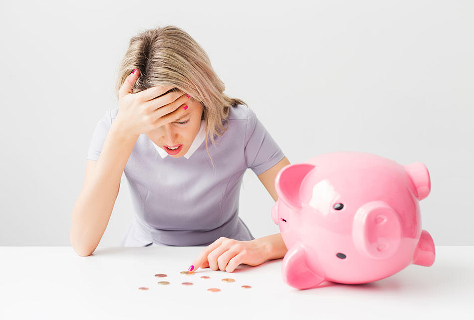 upset woman with pink bank and coins