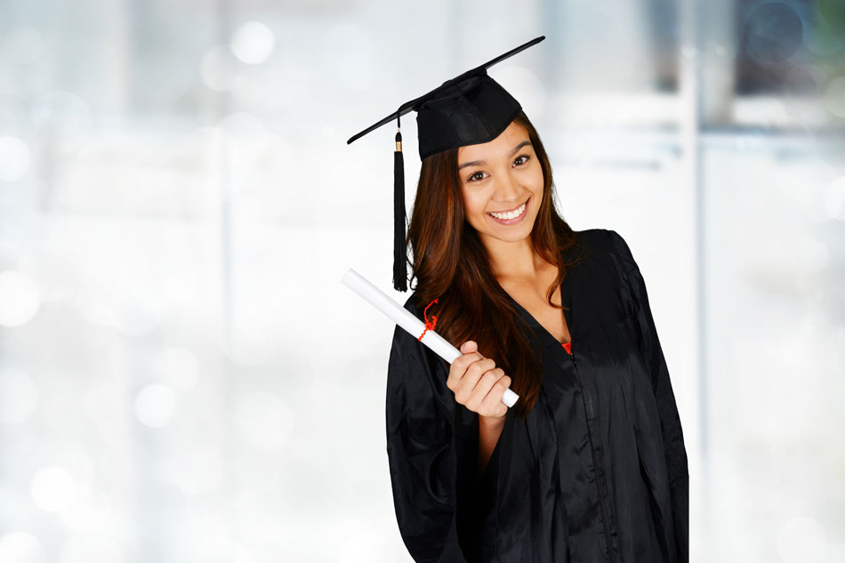 young woman wearing graduation cap and gown
