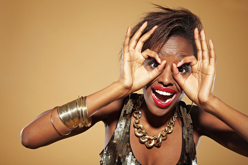 woman making circles with hands in front of face