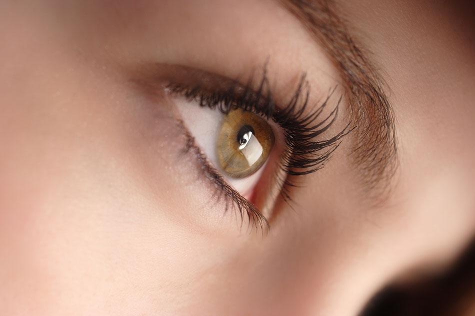 woman showing one hazel eye