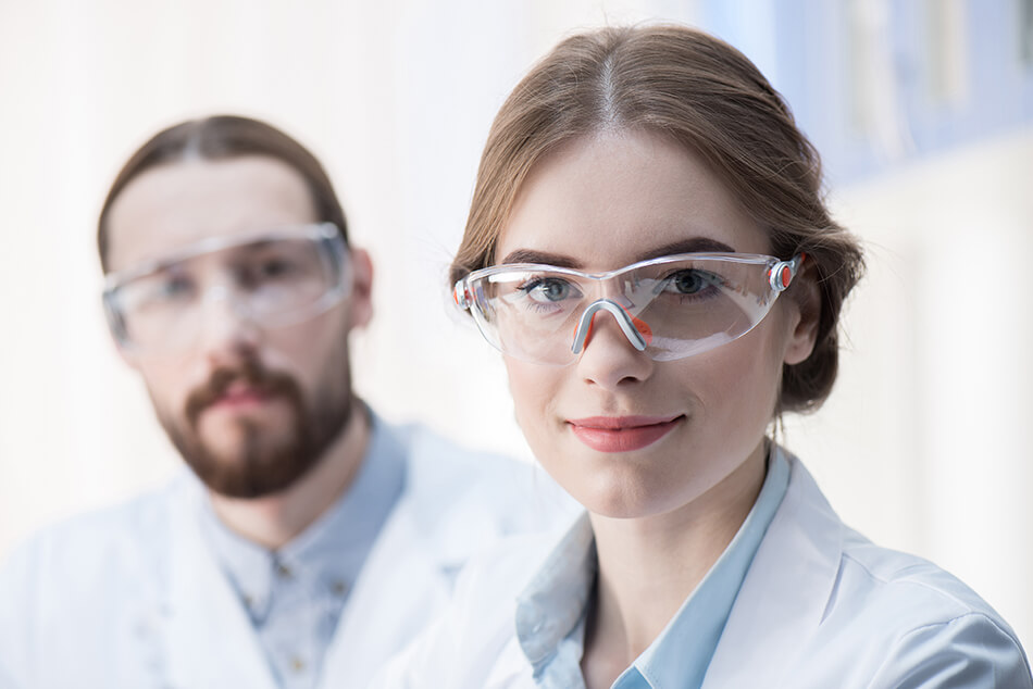 Woman and man wearing protective eyewear