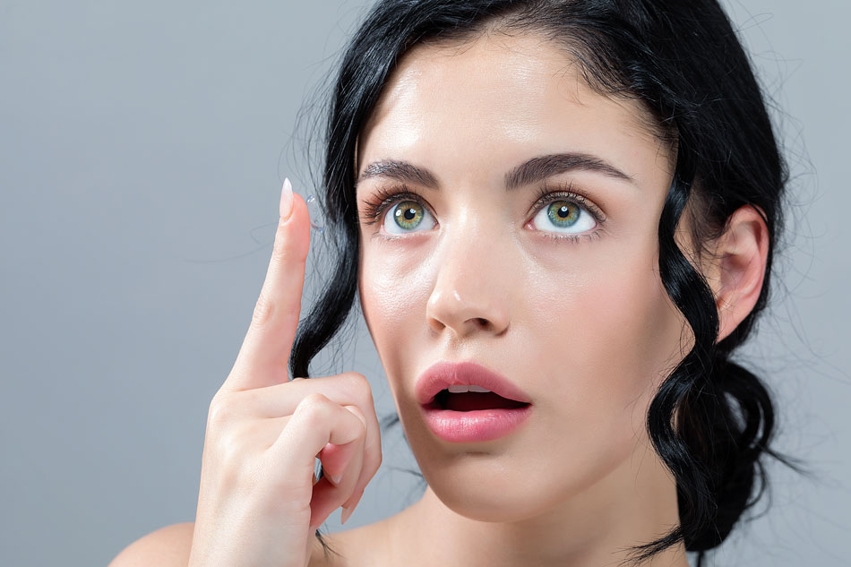 woman thinking whether to try extended wear contacts