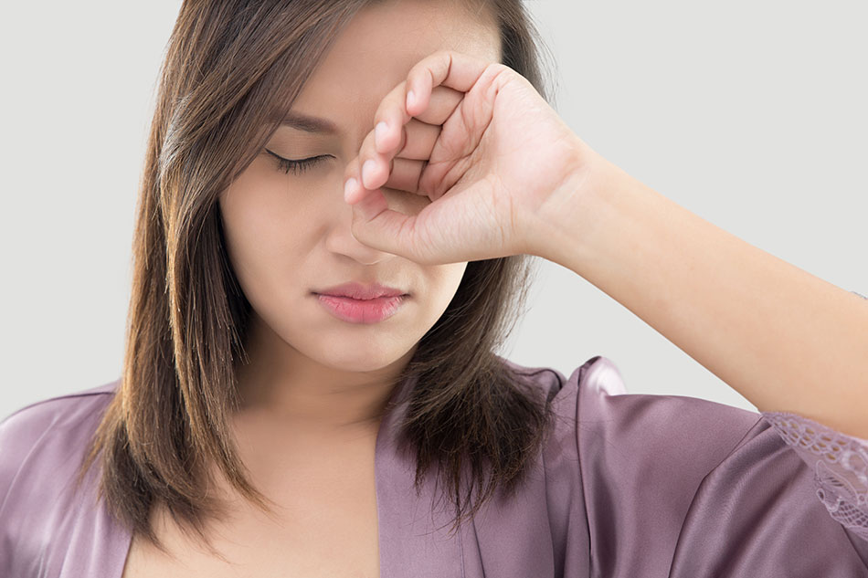 Young woman with contact lens intolerance