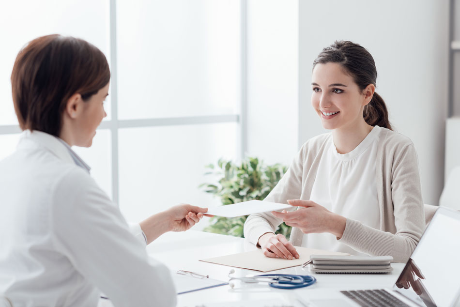 Young woman receiving contact prescription