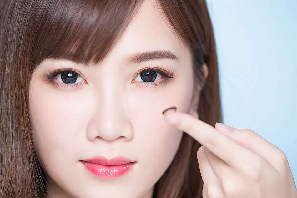 young woman with daily contact lenses