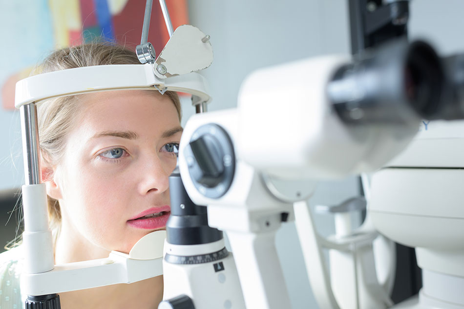 young woman having eye exam