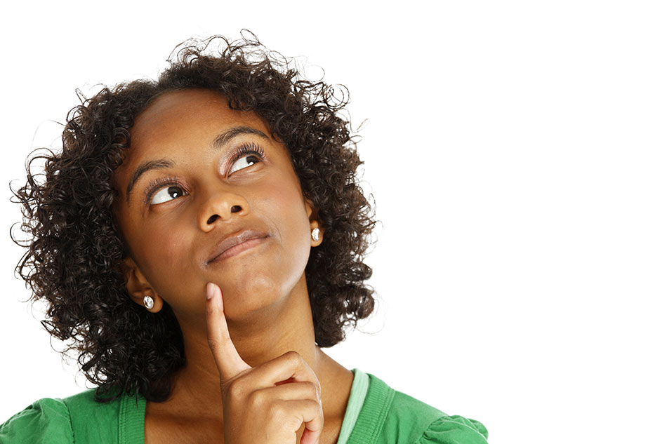 young woman in green shirt wondering about astigmatism and contacts