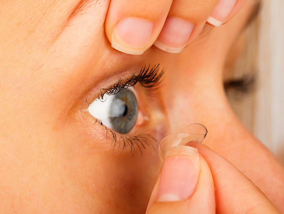 young woman removing contacts